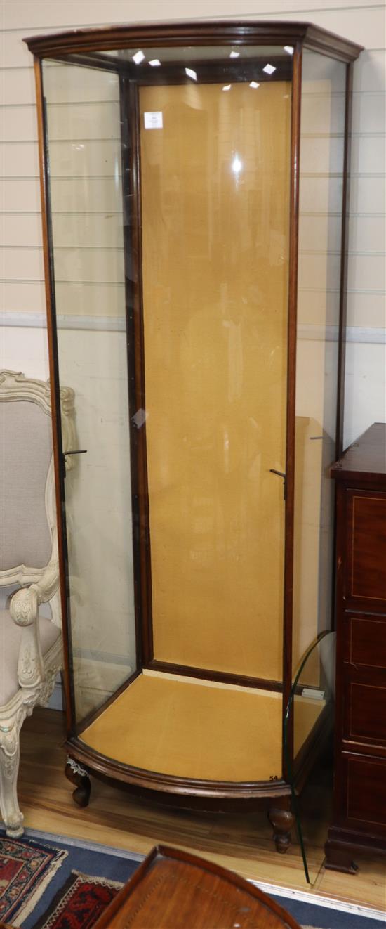 A 1920s mahogany bowfront shop display cabinet H.204cm